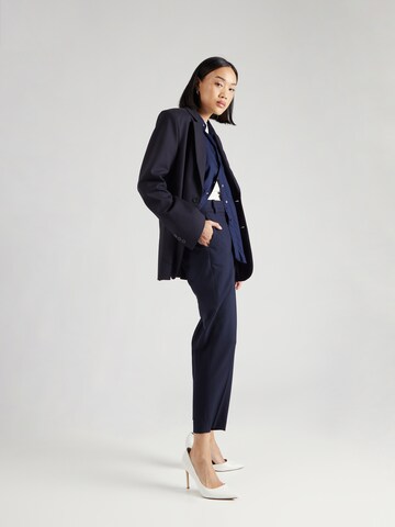TOMMY HILFIGER Slim fit Trousers in Blue
