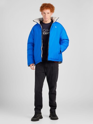 Calvin Klein Jeans Tussenjas 'Reversible 90s' in Blauw