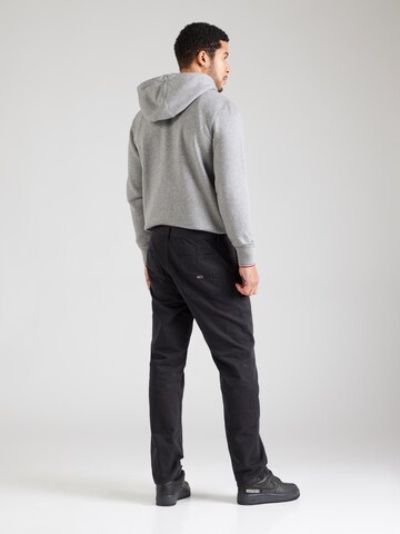 Tommy Jeans tavaline Püksid 'Ryan', värv must