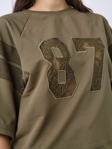 Haut ' Ely ' co'couture en vert