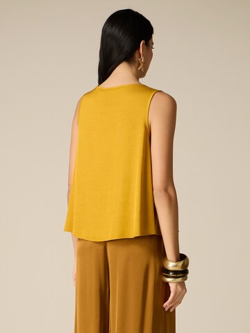 Haut oltre en jaune