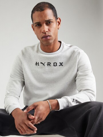 PUMA - Camiseta deportiva 'Puma x Hyrox' en gris: frente