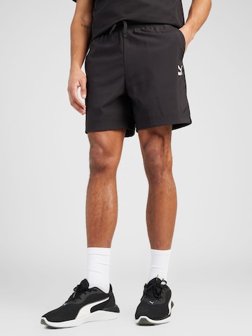 PUMA Regular Pants 'CLASSICS' in Black: front