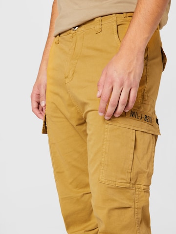Regular Pantalon cargo ALPHA INDUSTRIES en jaune