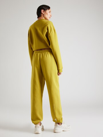 Effilé Pantalon de sport ADIDAS BY STELLA MCCARTNEY en jaune