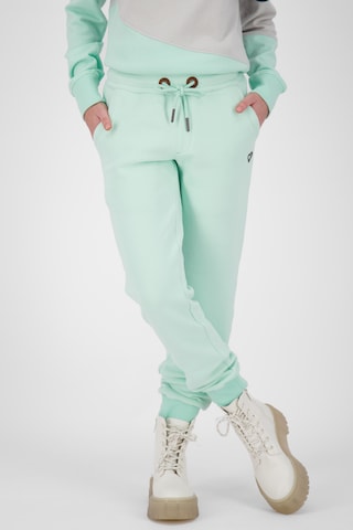 Alife and Kickin Tapered Pants 'MonalieAK' in Green: front