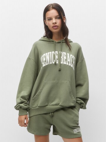 Pull&Bear Regular Trousers in Green: front
