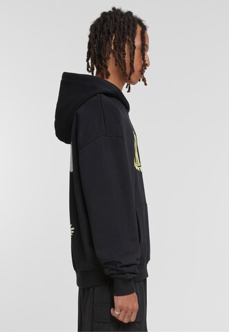 Bluză de molton 'Fortune Cranes' de la MT Upscale pe negru