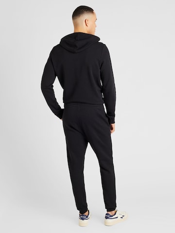 Reebok - regular Pantalón deportivo en negro