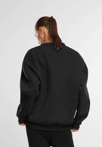 Felpa 'Essential' di Karl Kani in nero