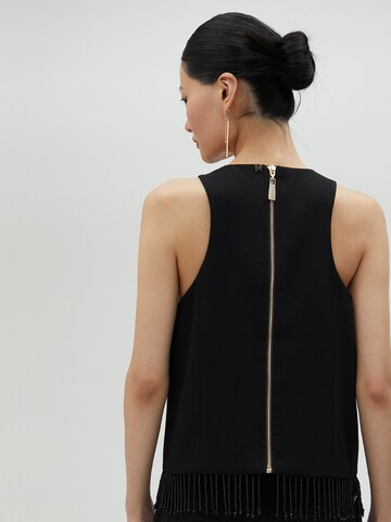 Top di Lola Casademunt in nero