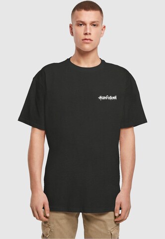 Merchcode Shirt 'Unfollow' in Black: front