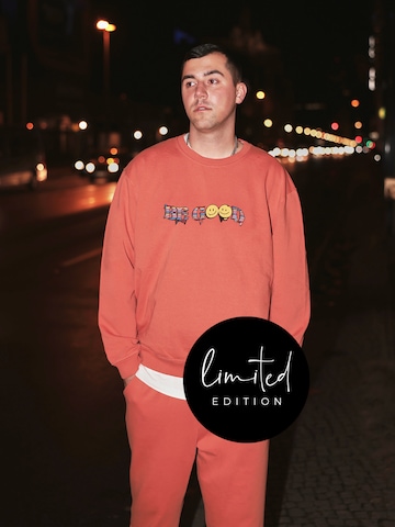 ABOUT YOU Limited Sweatshirt 'Kai' by Jannik Stutzenberger' in Oranje: voorkant