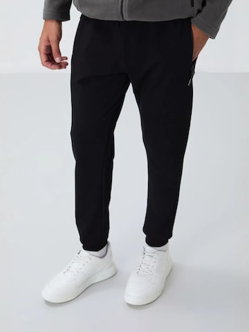 Regular Pantalon de sport Tommy Life en noir : devant