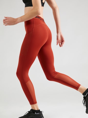 NIKE Skinny Športne hlače | oranžna barva