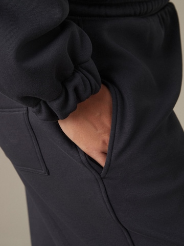 Loosefit Pantaloni di Next in grigio