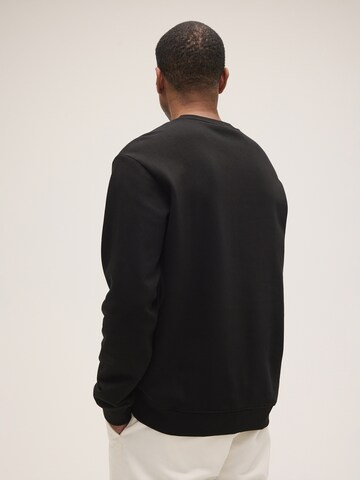 FILA Sweatshirt 'COREDO relaxed varsity brushed sweatshirt' in Zwart