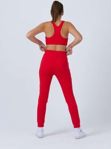 Loosefit Pantaloni sportivi 'Jogging Pants' di SPORTKIND in rosso