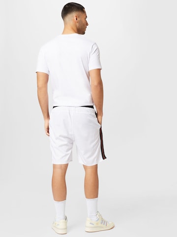 ELLESSE Normalny krój Spodnie sportowe 'Steady' w kolorze biały