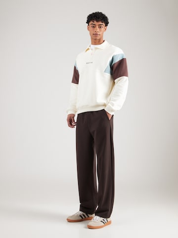 bēšs Kaotiko Sportisks džemperis