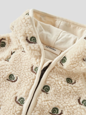 Lil'Atelier - Mono en blanco
