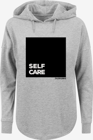 Sweat-shirt 'SELF CARE' F4NT4STIC en gris : devant