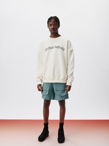 ABOUT YOU x Kingsley Coman Regular Cargo trousers 'Theo' in Green