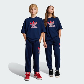 ADIDAS ORIGINALS Tapered Pants in Blue: front