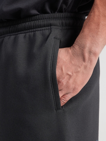 Nike Sportswear Loosefit Παντελόνι 'CLUB' σε μαύρο