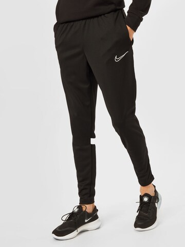 NIKE Slim fit Workout Pants in Black: front