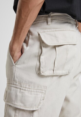 Karl Kani Regular Cargo trousers in Beige