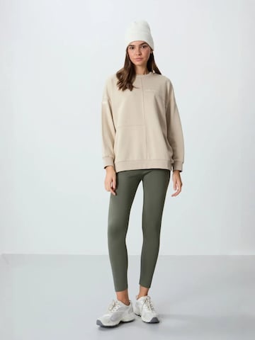 Sweat-shirt Tommy Life en beige : devant