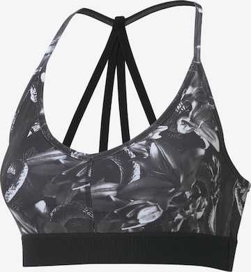 Reggiseno sportivo di PUMA in nero: frontale