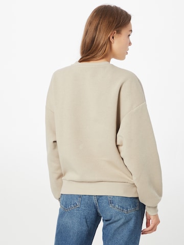 Sweat-shirt Gina Tricot en beige