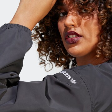 ADIDAS ORIGINALS Between-Season Jacket 'Cover Up' in Black