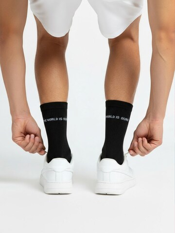 The Arctic Bay - Calcetines 'WORLD IS EDITION Gift box 4 Pack Unisex' en negro