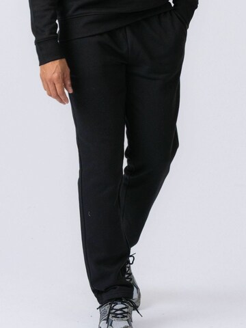 Regular Pantalon ' Essential Sweatpants ' TEESHOPPEN en noir
