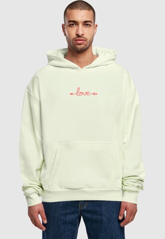 Merchcode Sweatshirt 'Hugs & Love - Love Arrow' in Grün: Vorderseite