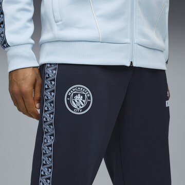 PUMA Tapered Sportbroek 'Manchester City King Anthem' in Blauw