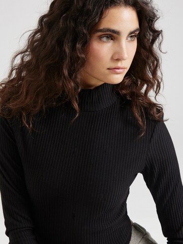 Maglietta di Gina Tricot in nero