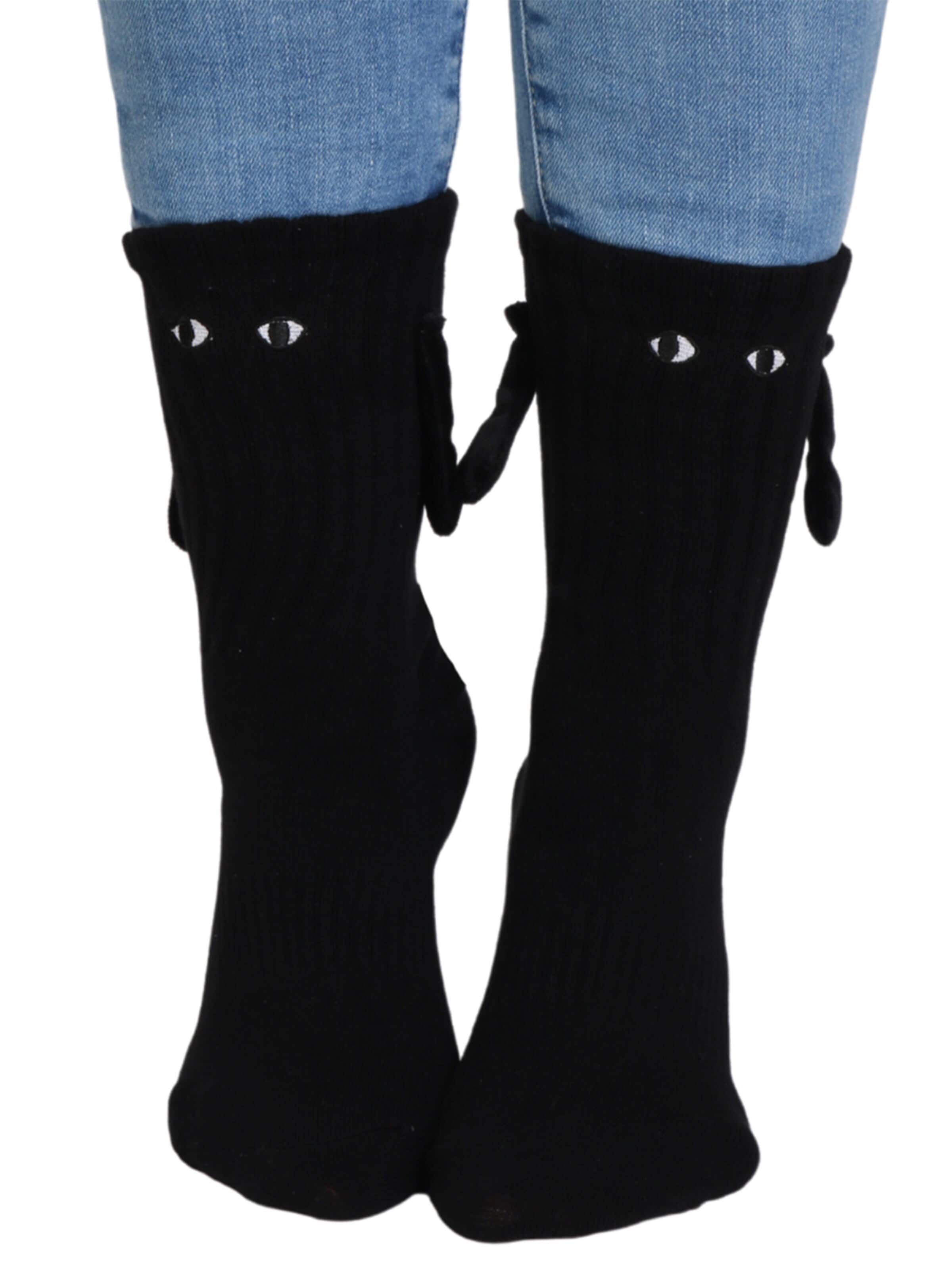 Sokisahtel Socks 'MAGNET socks with magnetic hands' in Black: front