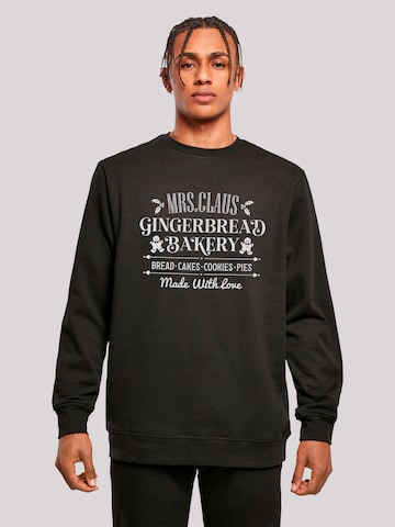 Sweat-shirt 'Santas Gingerbread Bakery Retro Christmas' F4NT4STIC en noir : devant