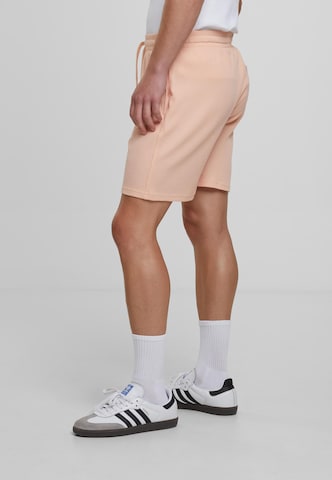 Urban Classics Loose fit Trousers in Orange
