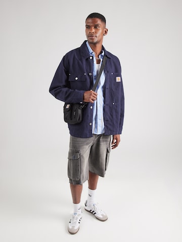 Carhartt WIP Overgangsjakke 'Walter Chore' i blå