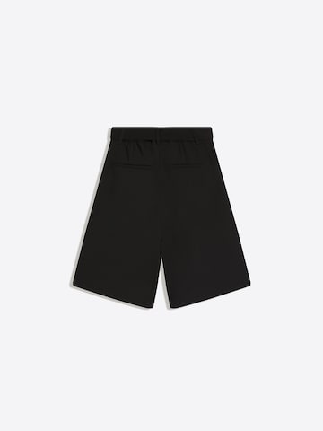 Bershka Vrečasti Hlače z naborki | črna barva