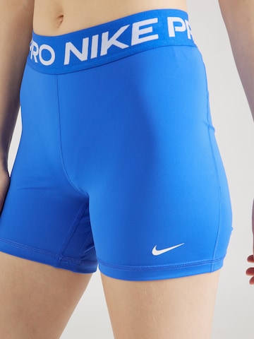 NIKE Skinny Urheiluhousut 'Pro 365' värissä sininen