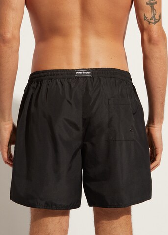 CALZEDONIA Board Shorts in Black: front