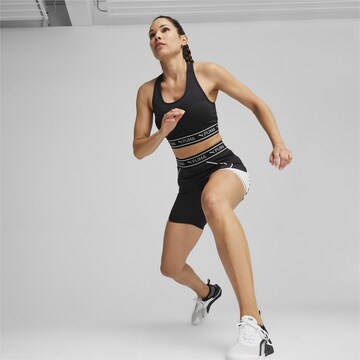 PUMA Skinny Sportbroek 'TRAIN STRONG 5' in Zwart