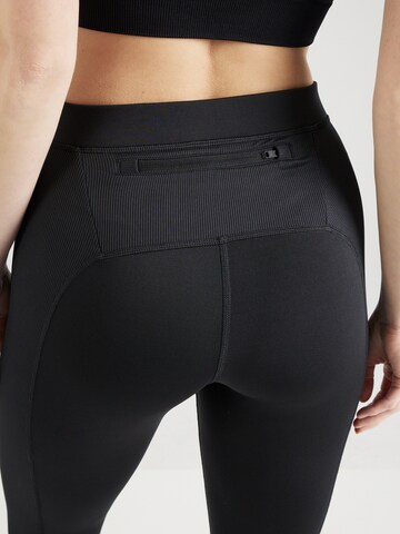 Reebok - Skinny Calças de desporto 'Vector' em preto