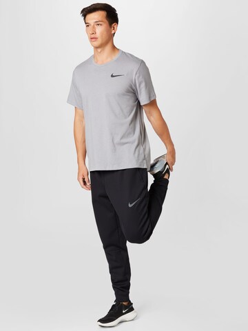 NIKE Functioneel shirt 'Burnout' in Grijs